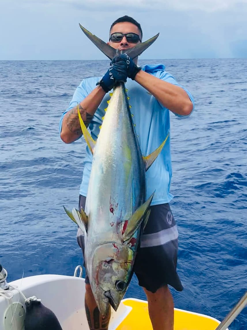 Fishing: A hefty yellowfin tuna brought aboard